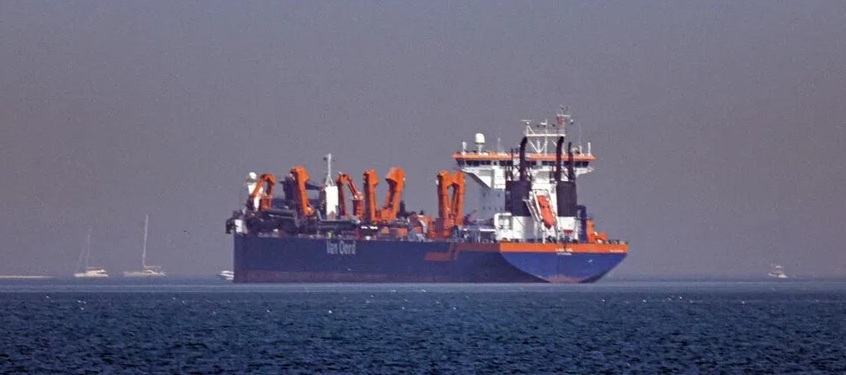 Vessel cruises along the ocean